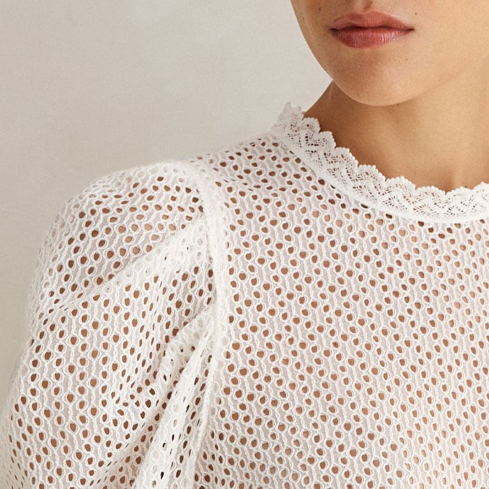 Flattering poufs at the shoulders add drama to the long sleeves.