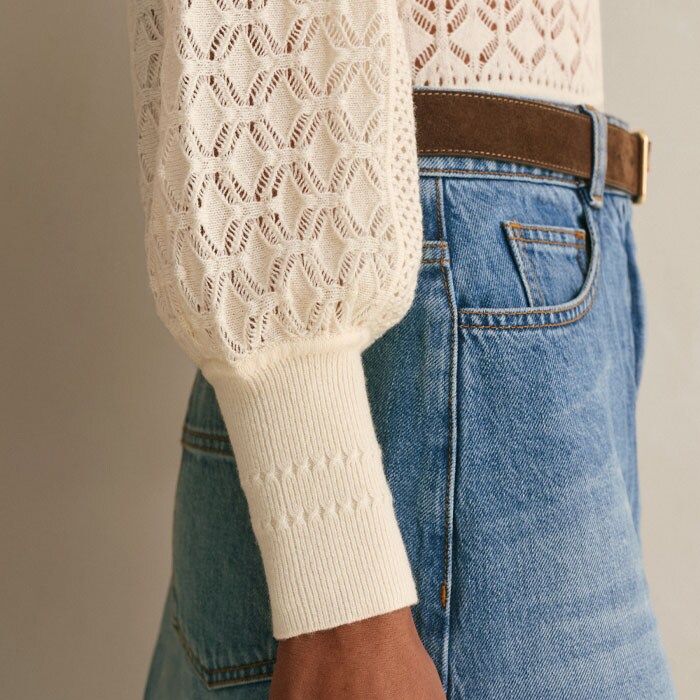 Falling to deep fitted cuffs, the balloon sleeves emphasise the lightness of the knit.